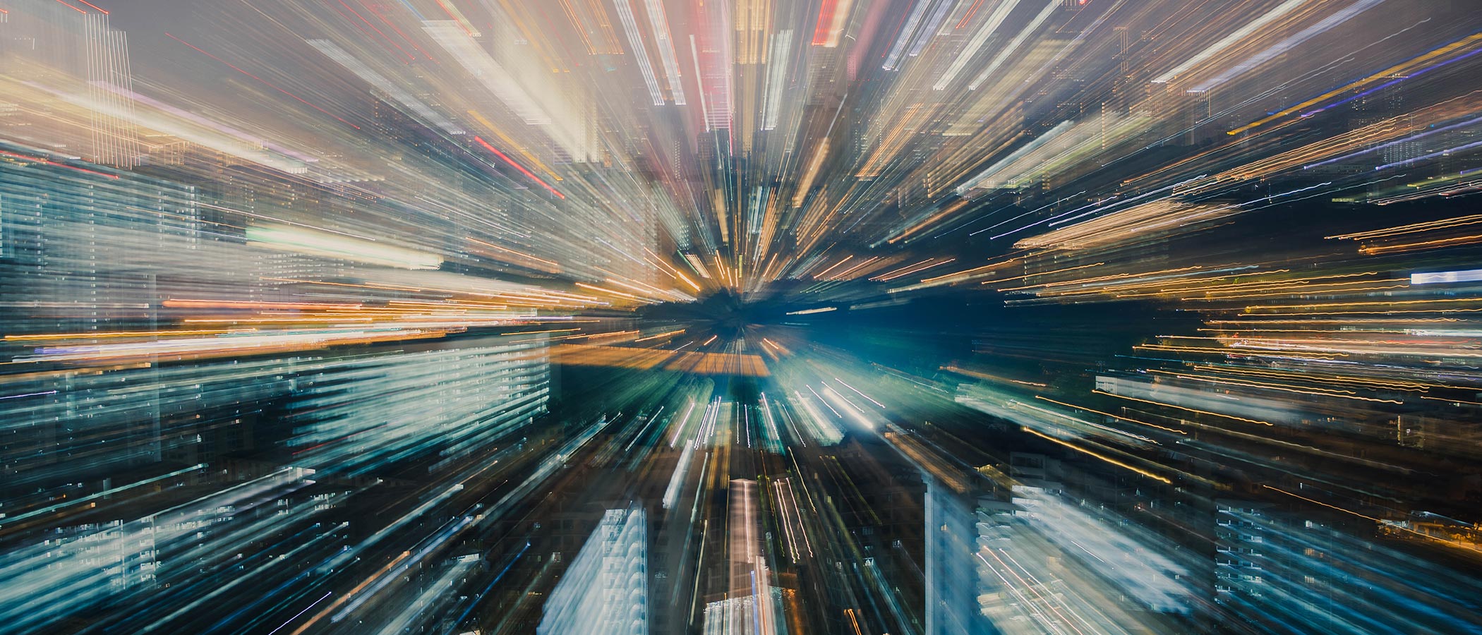 Urban skyline zoom effect creating radiating lines of city lights