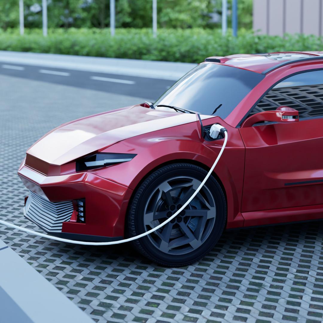 Electric car plugged into charging station